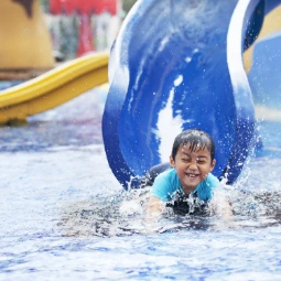 Cute Kid On a Water Slide